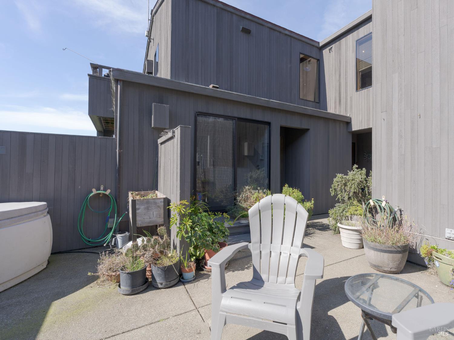 39574 Leeward Road The Sea Ranch, CA 95497 - Photo 48 of 72 a view of a chair and table in the back yard of the house