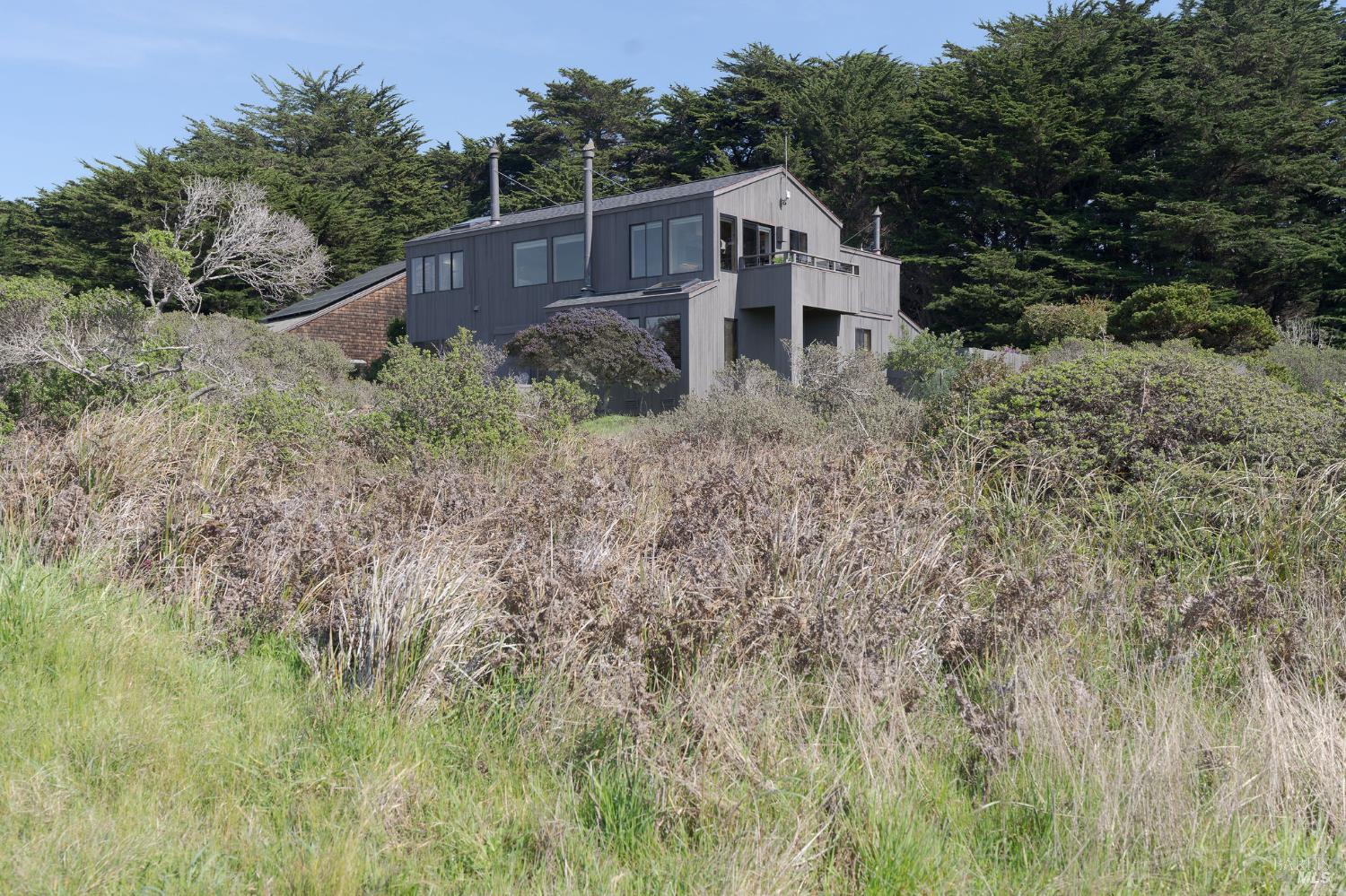 39574 Leeward Road The Sea Ranch, CA 95497 - Photo 51 of 72 a view of a house with a yard