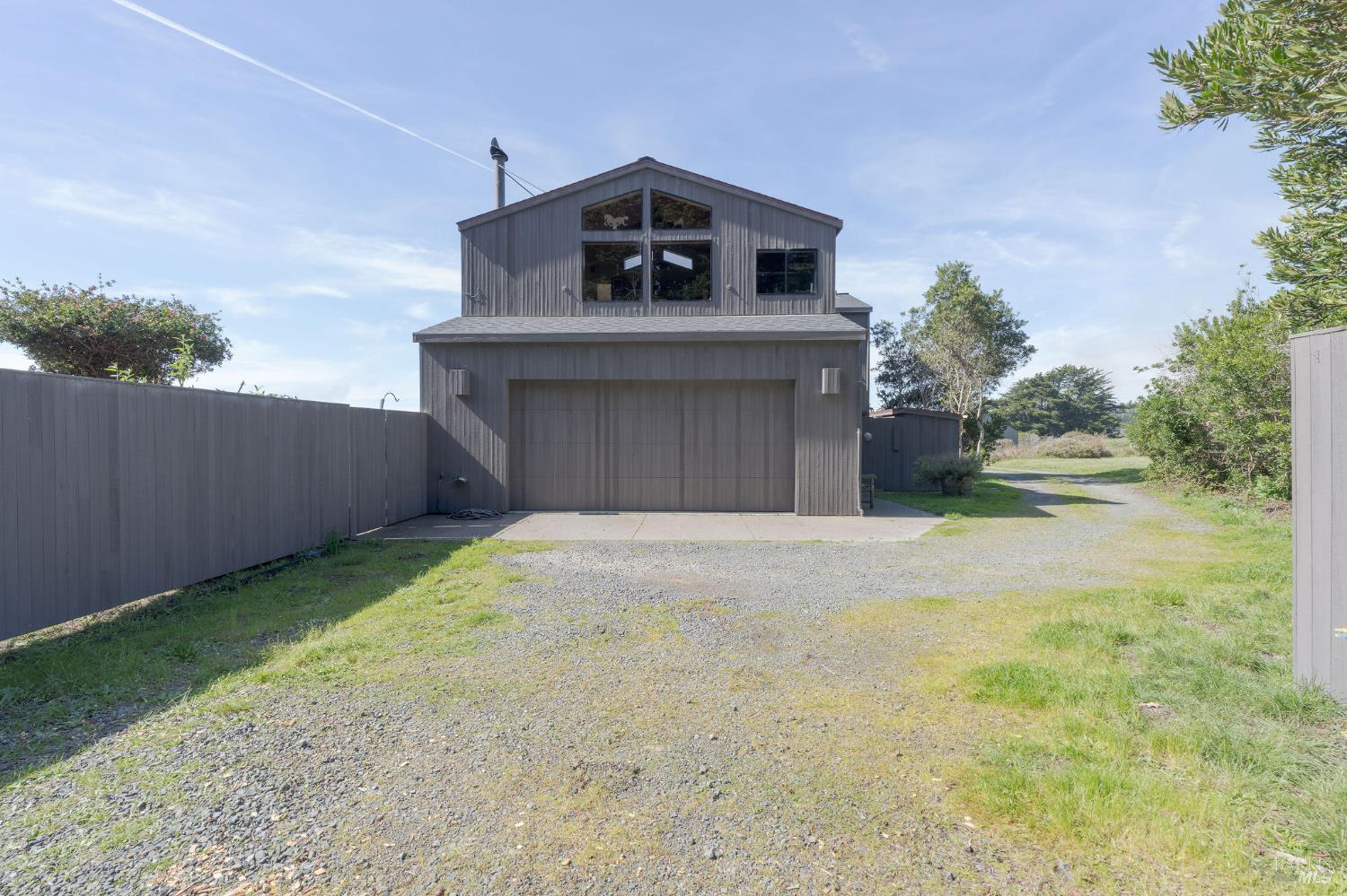 39574 Leeward Road The Sea Ranch, CA 95497 - Photo 52 of 72 a front view of a house with a yard