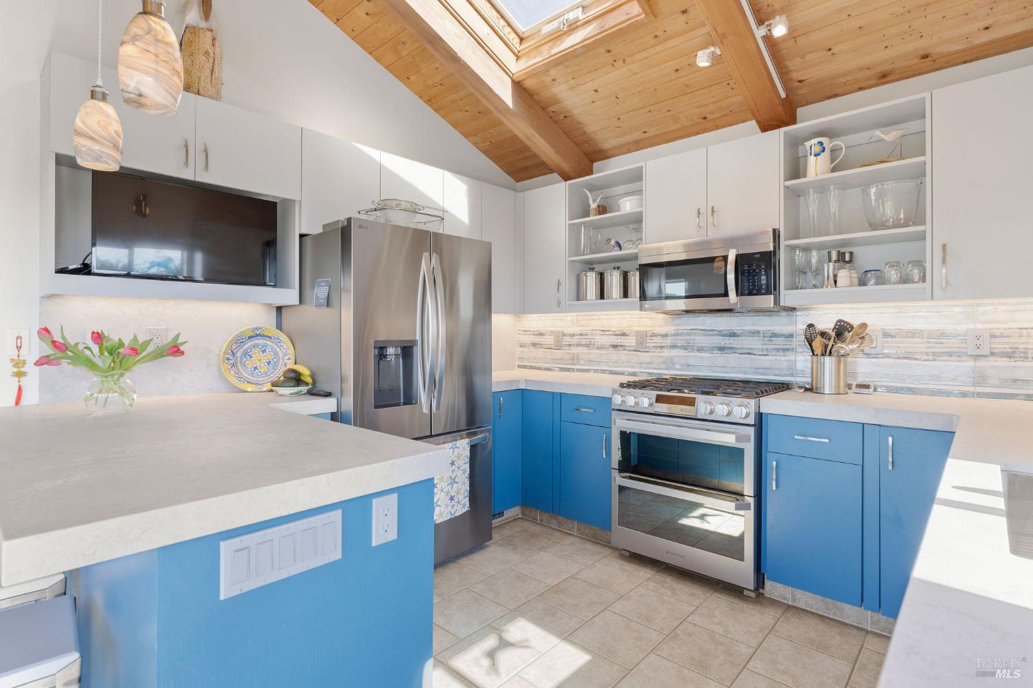 39574 Leeward Road The Sea Ranch, CA 95497 - Photo 6 of 72 a kitchen with stainless steel appliances granite countertop a sink and a microwave