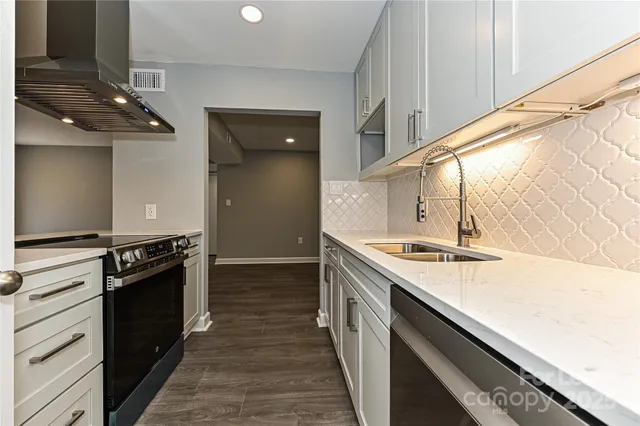 a kitchen with a stove and a kitchen