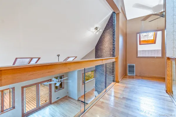 a view of an entryway with wooden floor