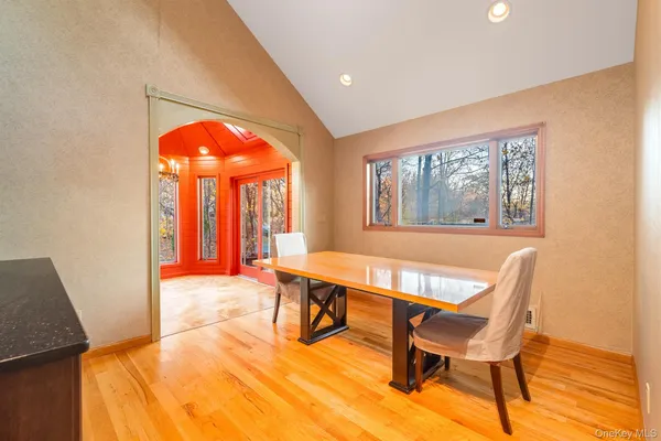 a view of a livingroom with furniture window and wooden floor