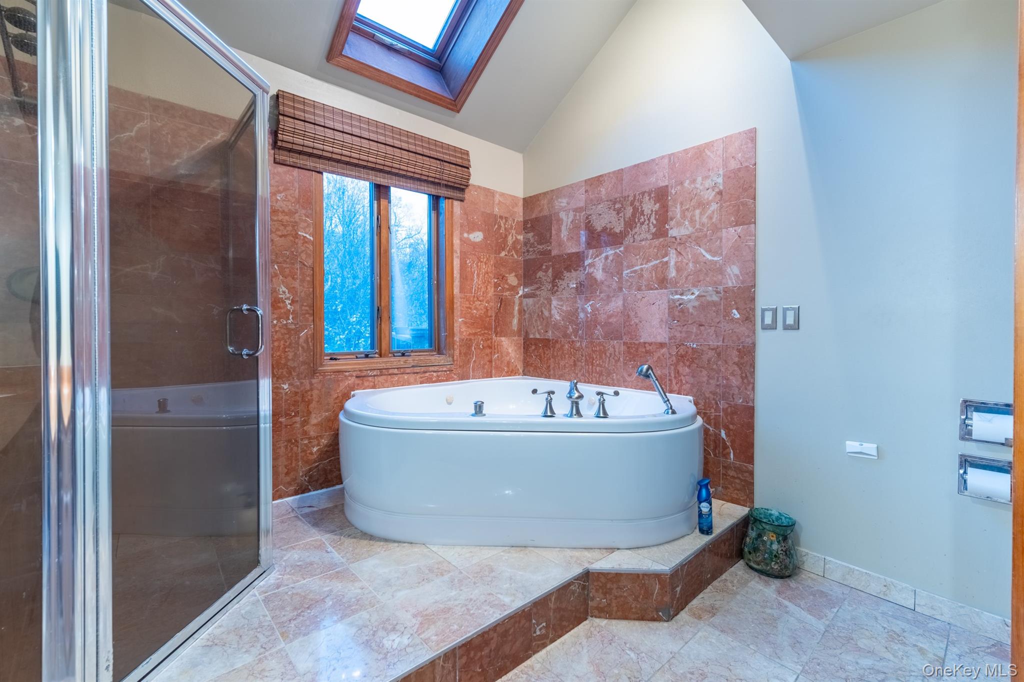 22 Weyant Road Fort Montgomery, NY 10922 - Photo 21 of 26 Full bath featuring a skylight, a garden tub, vaulted ceiling, a shower stall, and tile walls