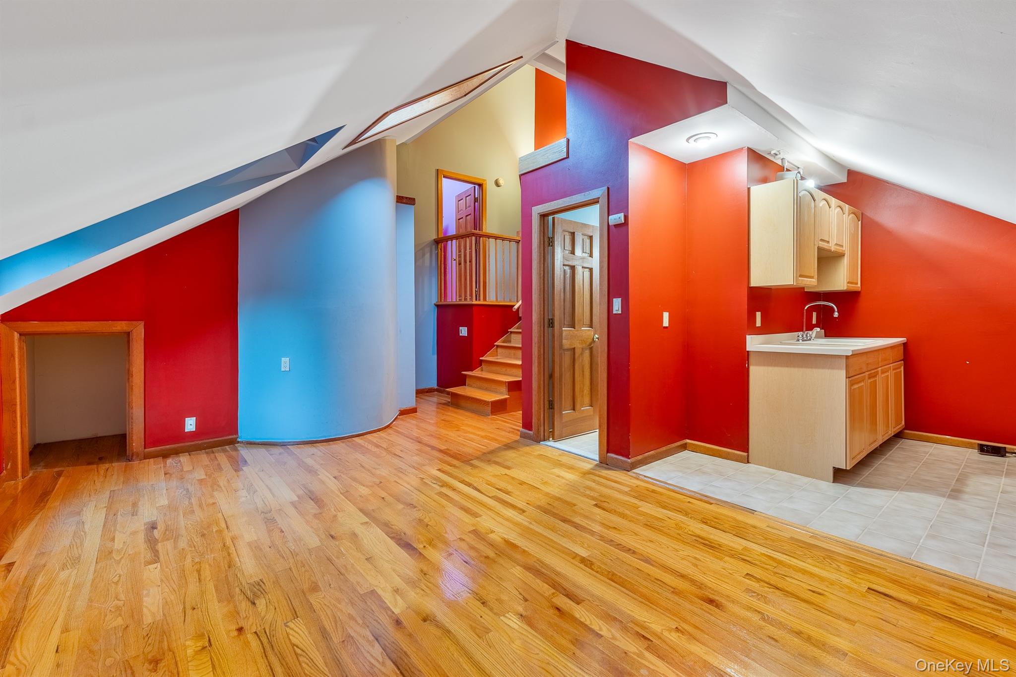 22 Weyant Road Fort Montgomery, NY 10922 - Photo 23 of 26 Bonus room featuring vaulted ceiling, light wood-type flooring, stairway, and a skylight