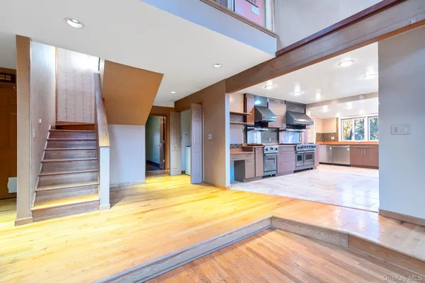 a large kitchen with a large counter top appliances and cabinets