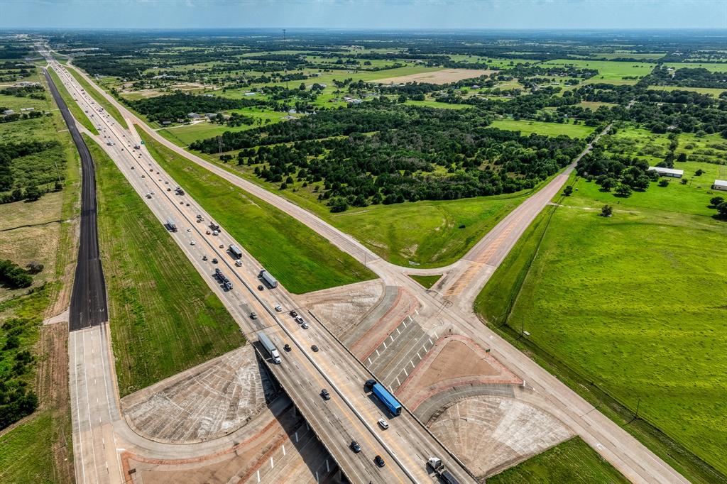 18201 Interstate 35 West, TX 76691 - Photo 13 of 22 a view of a yard with an outdoor seating