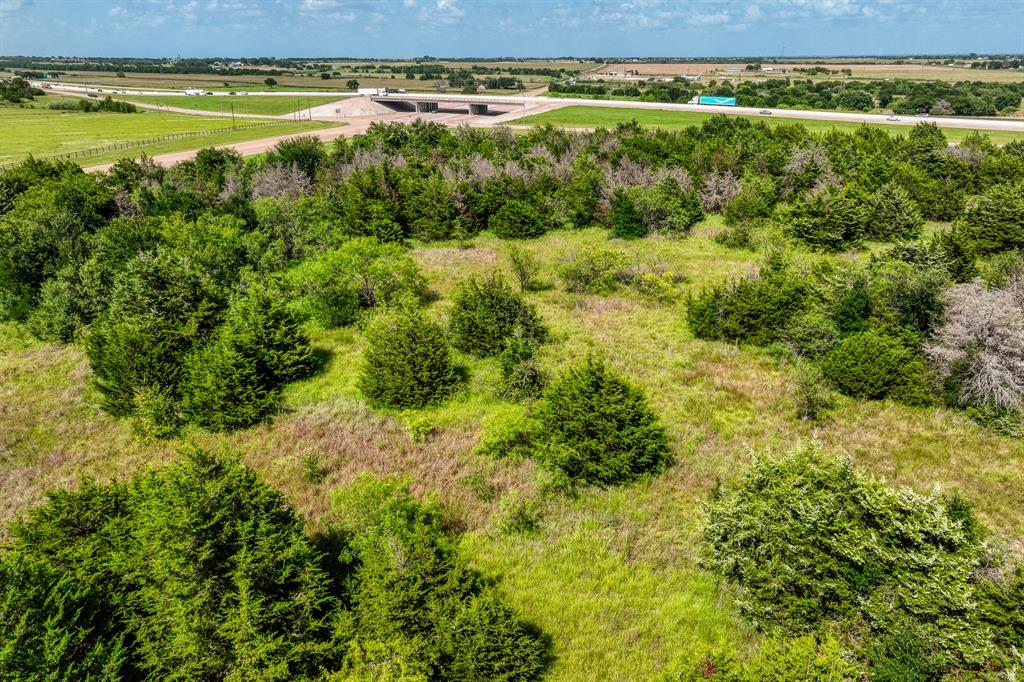 18201 Interstate 35 West, TX 76691 - Photo 21 of 22 a view of a garden with an outdoor space