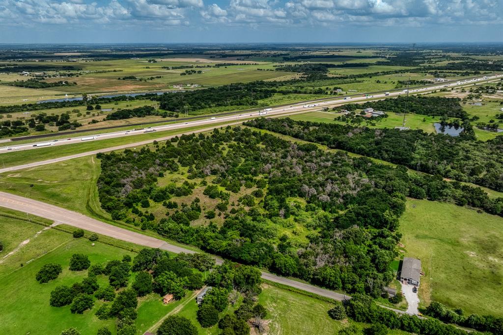 18201 Interstate 35 West, TX 76691 - Photo 3 of 22 a view of a yard with an outdoor seating