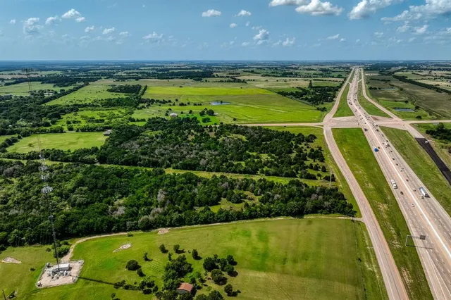 a view of a swimming pool with a garden