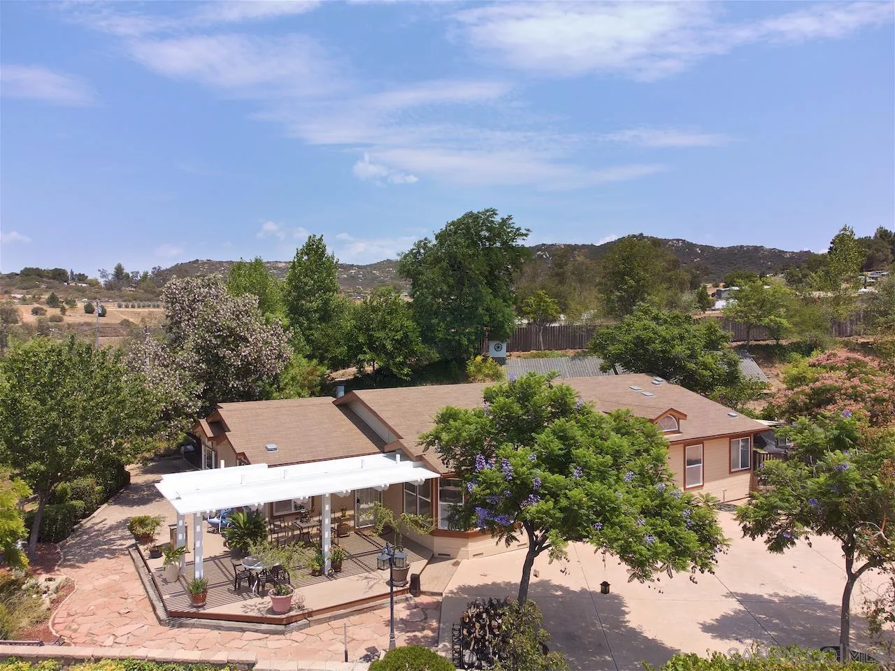 21851 Japatul Road Alpine, CA 91901 - Photo 42 of 52 an aerial view of a house with a yard and mountains