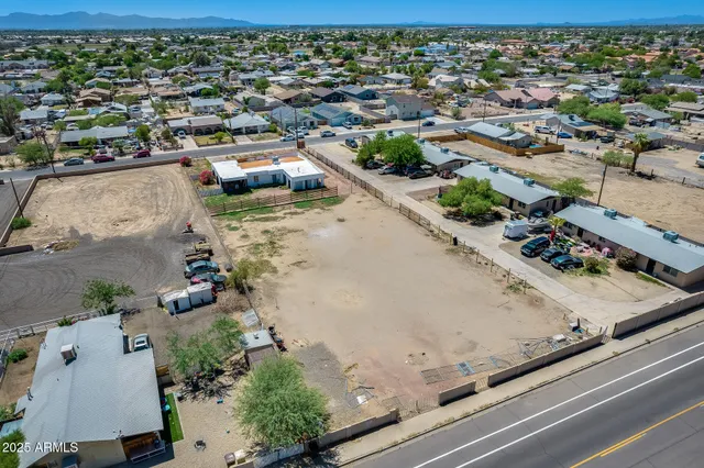 an aerial view of residential houses with outdoor space