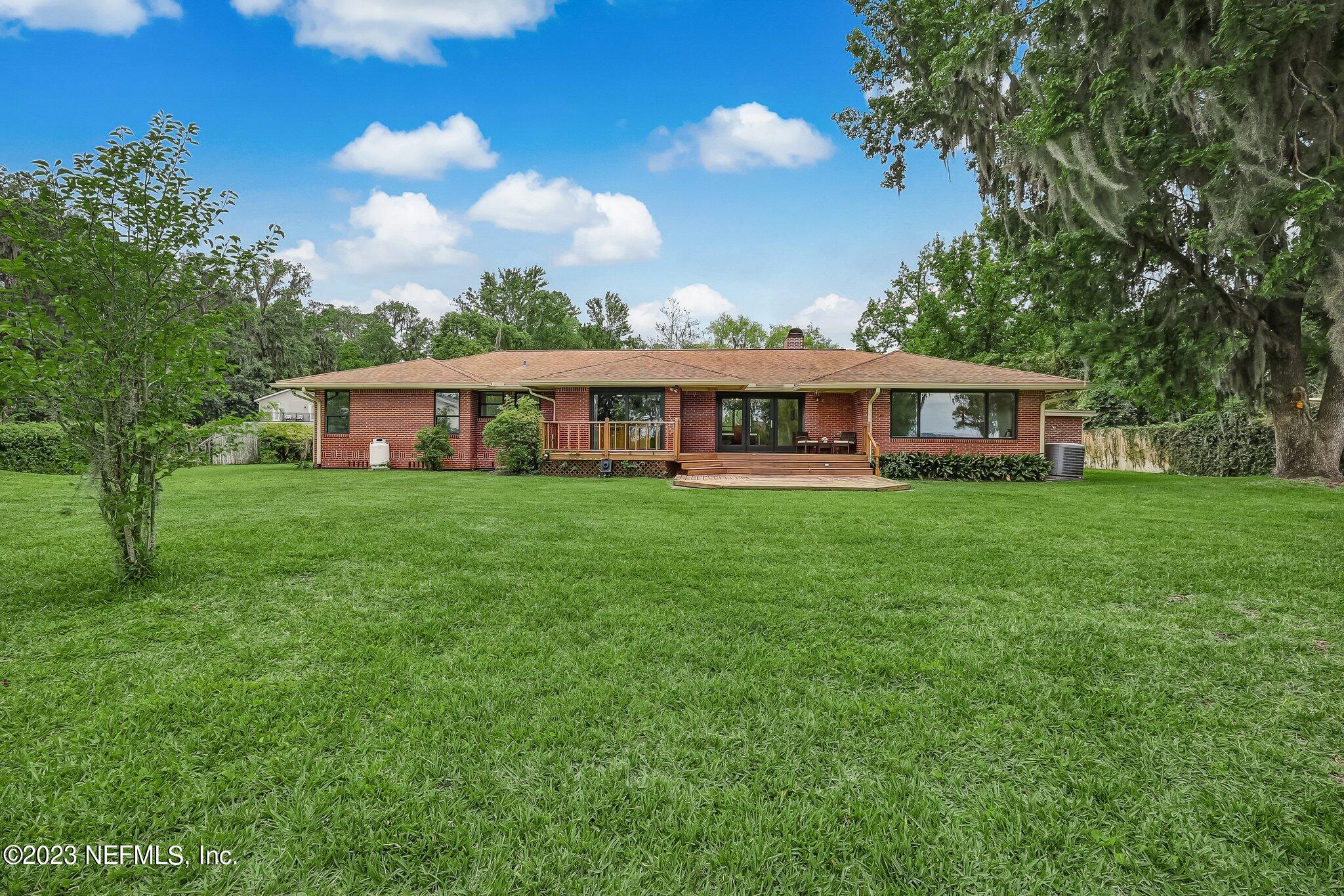 12834 Mandarin Road Jacksonville, FL 32223 - Photo 40 of 51 a view of a house with a big yard
