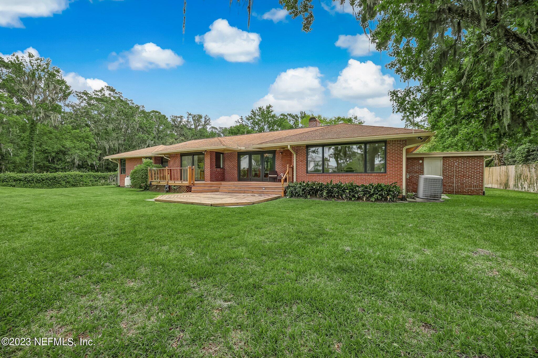 12834 Mandarin Road Jacksonville, FL 32223 - Photo 41 of 51 a view of a house with a backyard