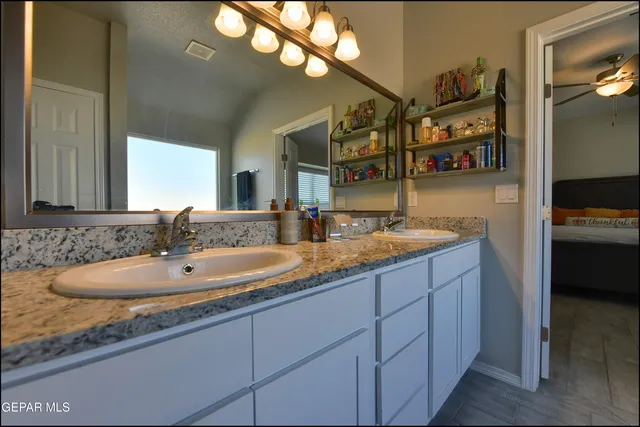 a bathroom with a sink and a mirror