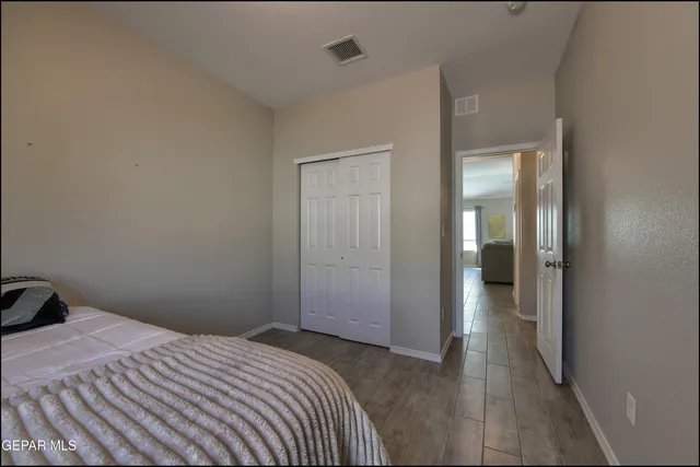 a bedroom with a bed and closet