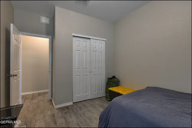 a room that has a bed and a closet in it