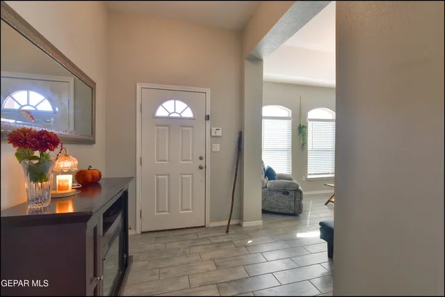 a view of an entryway with wooden floor