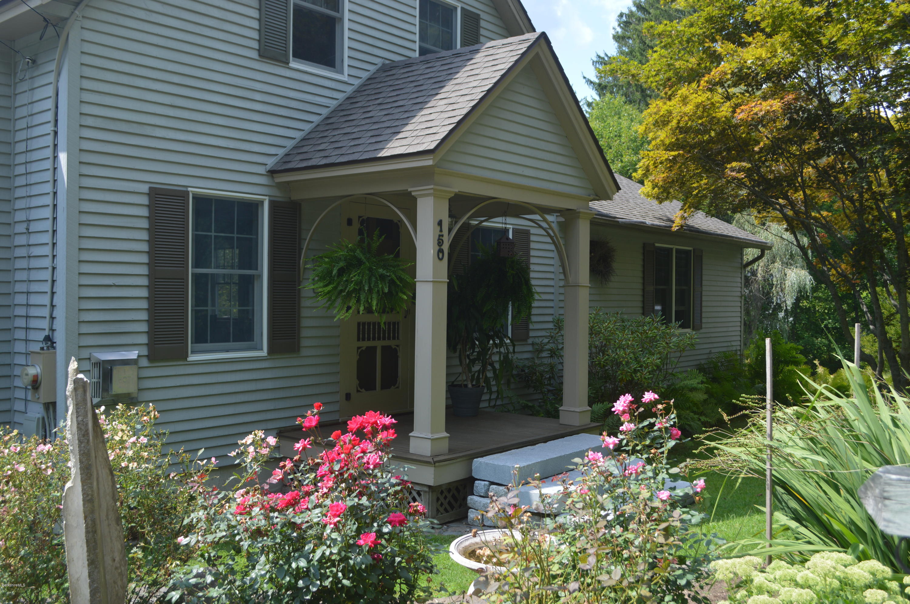 150 Maple Street Lee, MA 01238 - Photo 1 of 57 a front view of a house