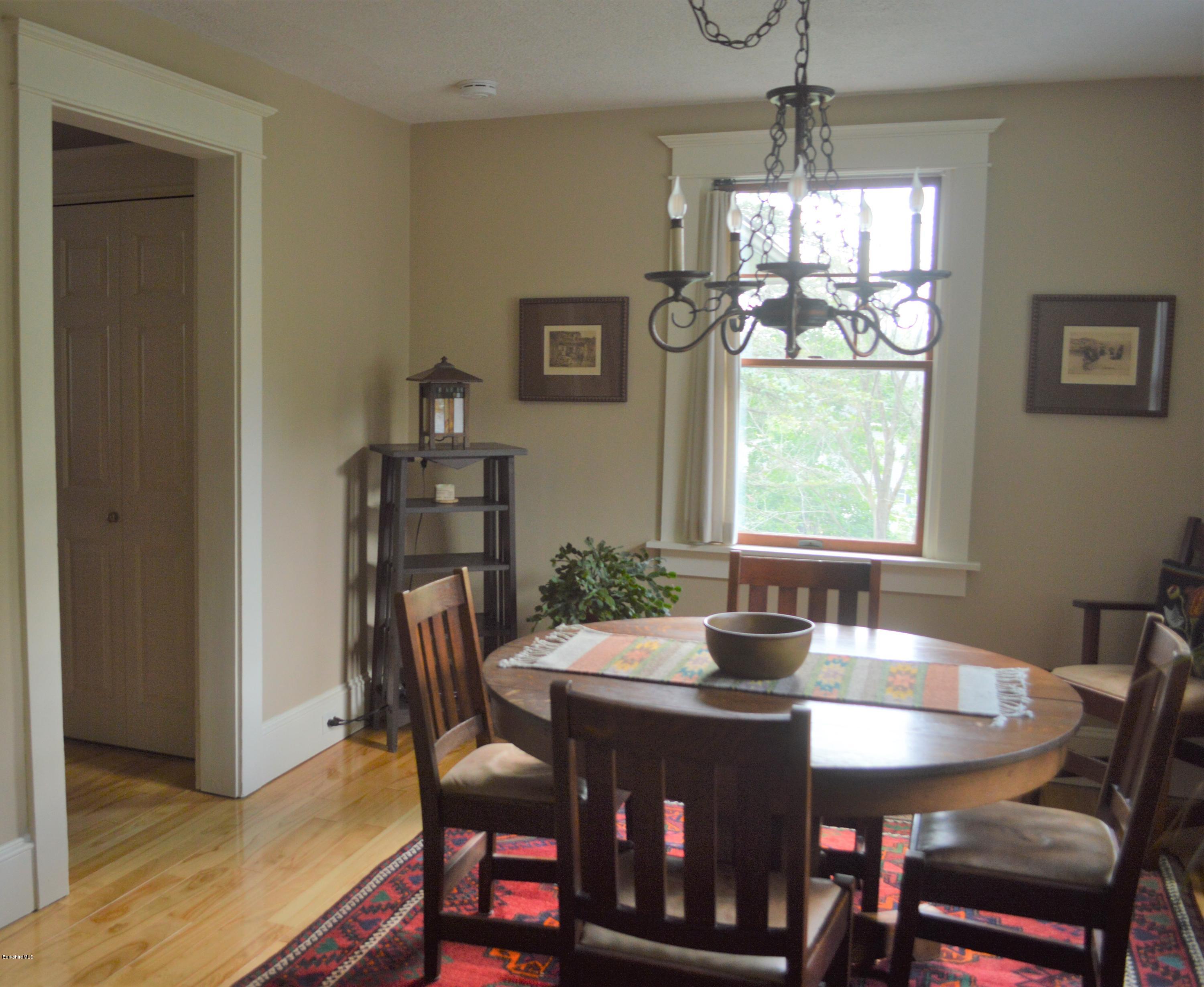 150 Maple Street Lee, MA 01238 - Photo 11 of 57 a dining room with furniture a chandelier and window