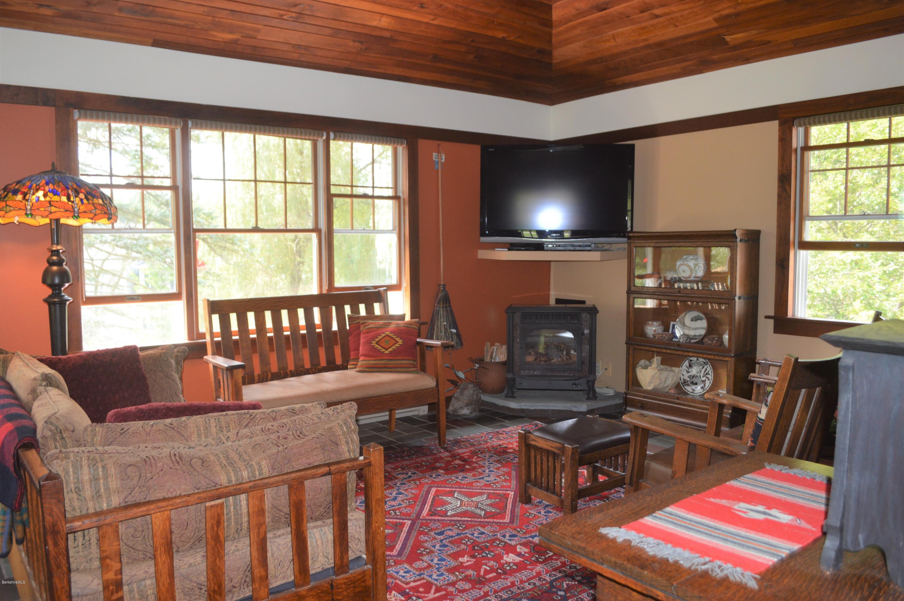 150 Maple Street Lee, MA 01238 - Photo 18 of 57 a living room with furniture and a flat screen tv