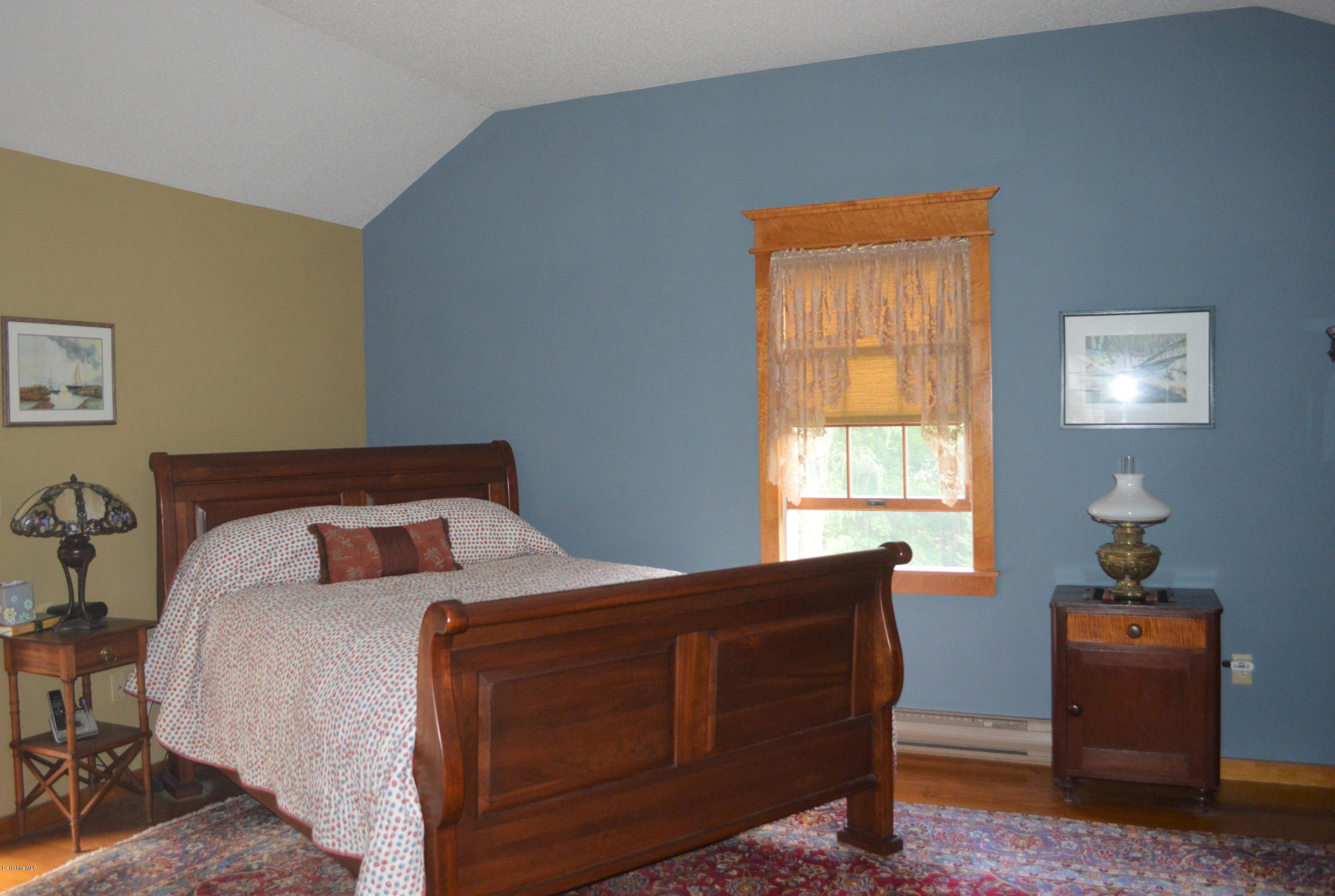 150 Maple Street Lee, MA 01238 - Photo 22 of 57 a bedroom with a bed and a window