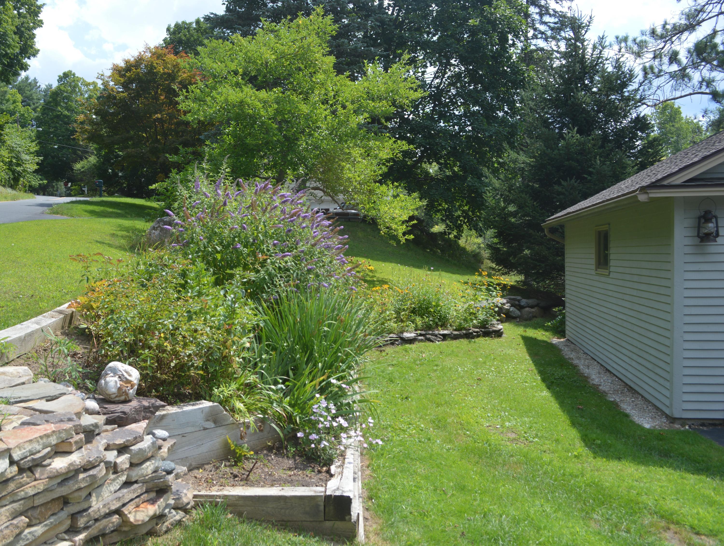 150 Maple Street Lee, MA 01238 - Photo 40 of 57 a backyard of a house with lots of green space