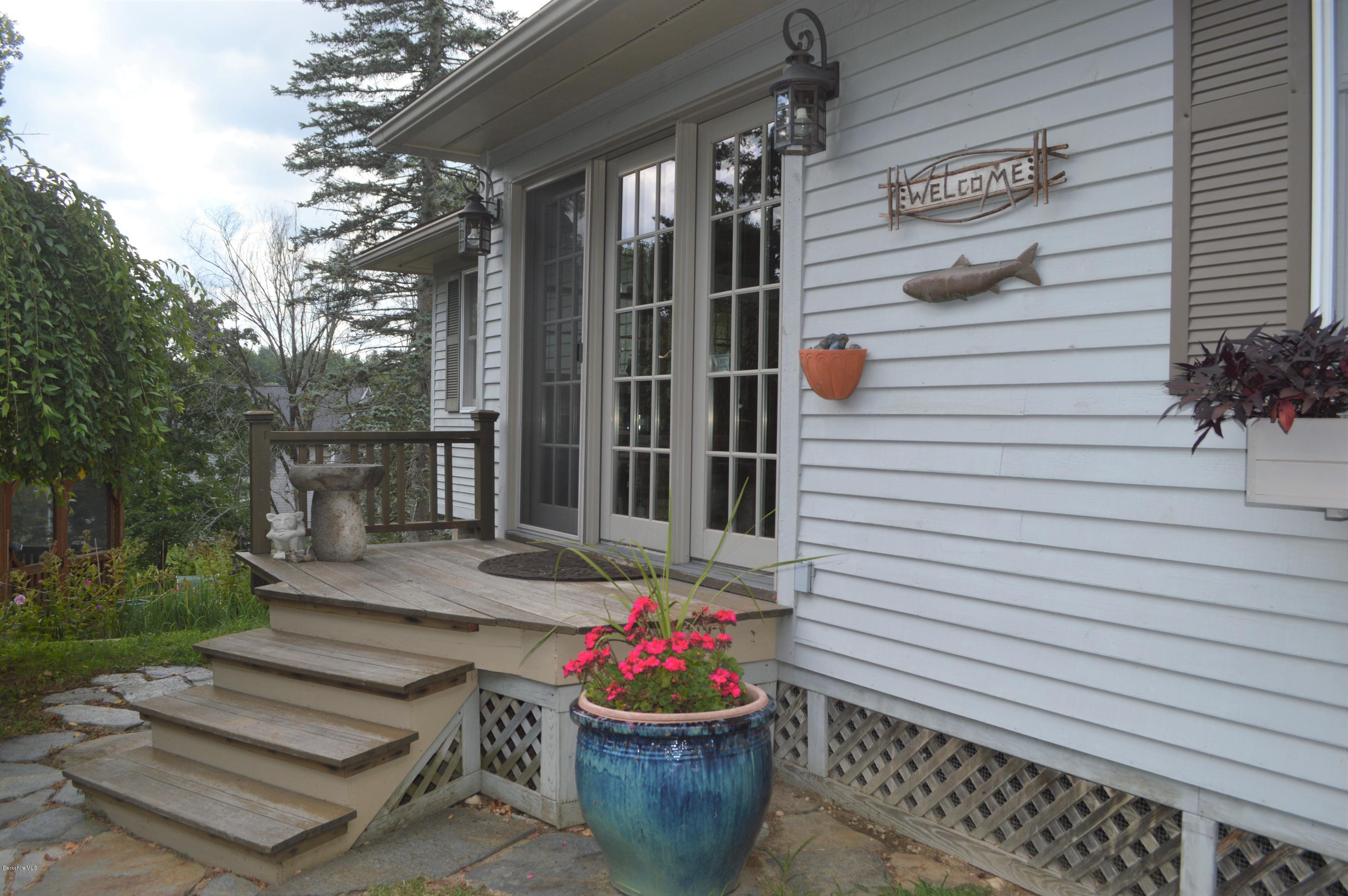 150 Maple Street Lee, MA 01238 - Photo 41 of 57 a potted plant sitting in front of a house
