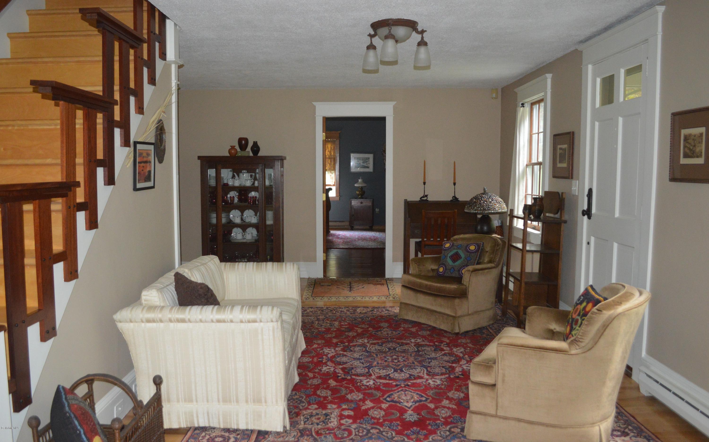 150 Maple Street Lee, MA 01238 - Photo 6 of 57 a living room with furniture and a rug