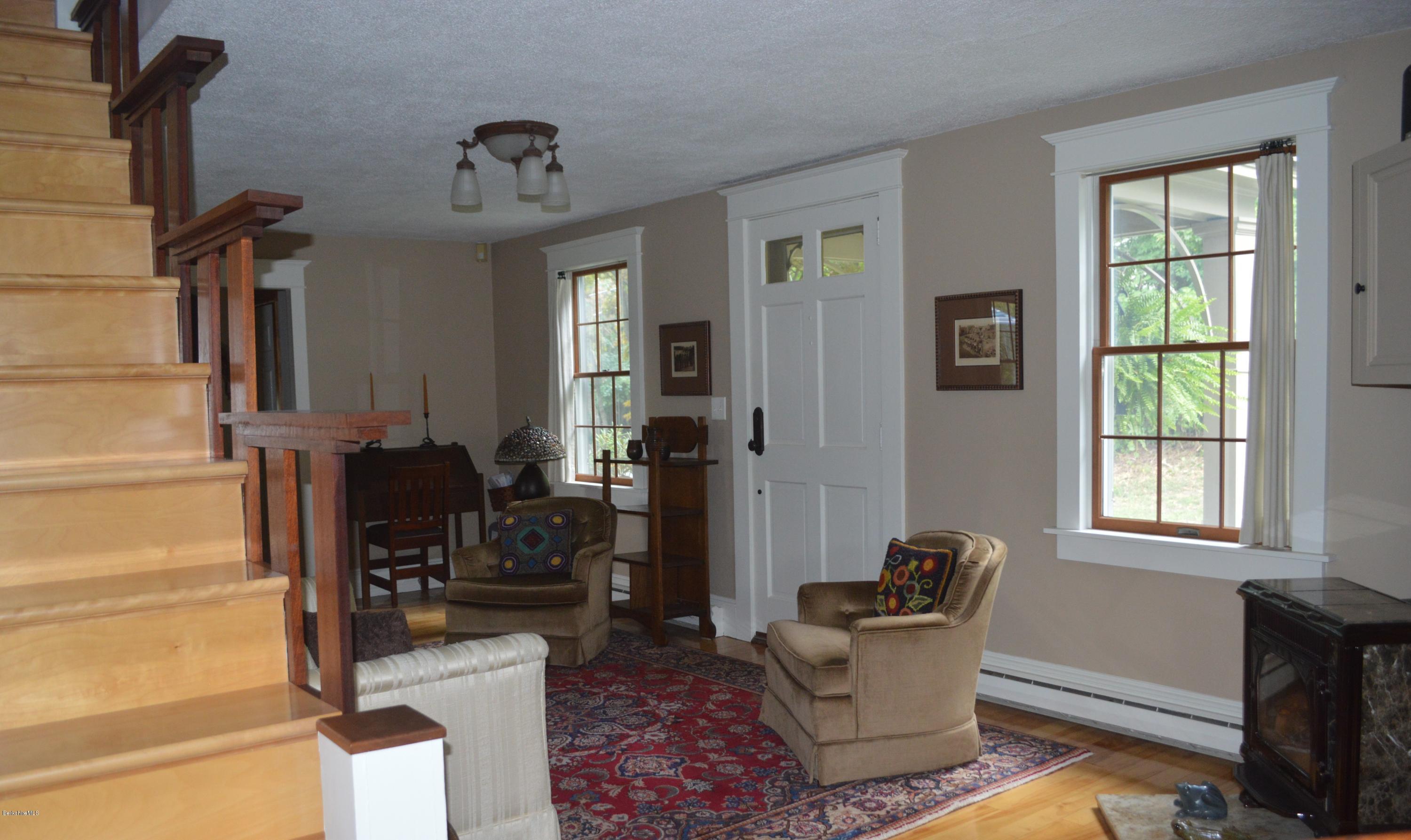150 Maple Street Lee, MA 01238 - Photo 7 of 57 a living room with furniture a window and potted plants