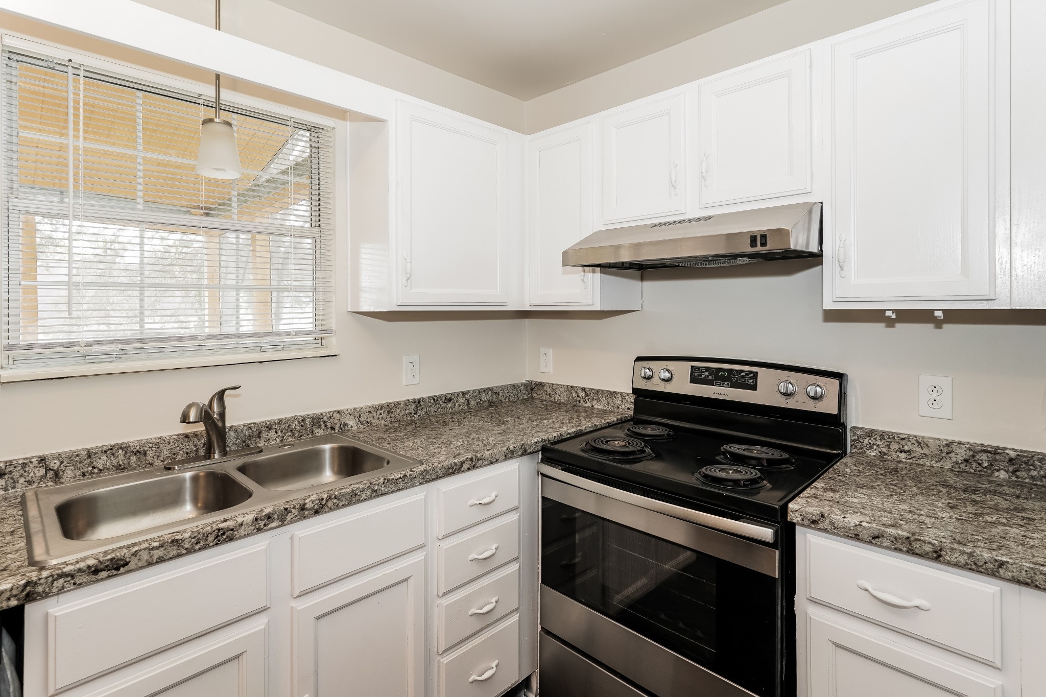 508 Robbie Ann Court Madison, TN 37115 - Photo 4 of 17 a kitchen with stainless steel appliances granite countertop white cabinets and a stove a sink