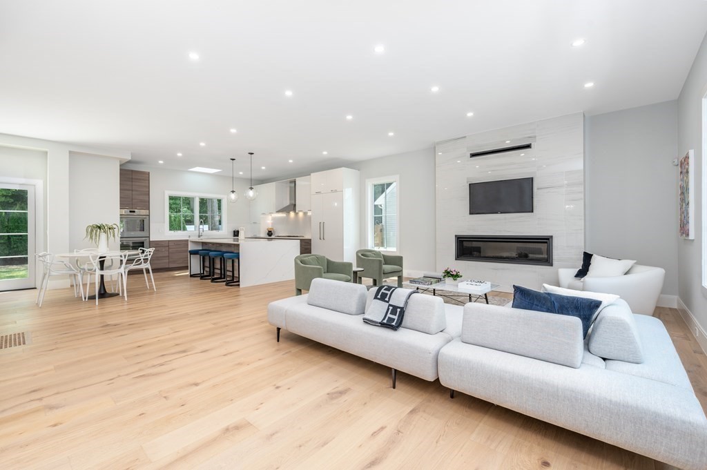 142 Bellingham Road Chestnut Hill, MA 02467 - Photo 5 of 37 a living room with furniture and a view of kitchen