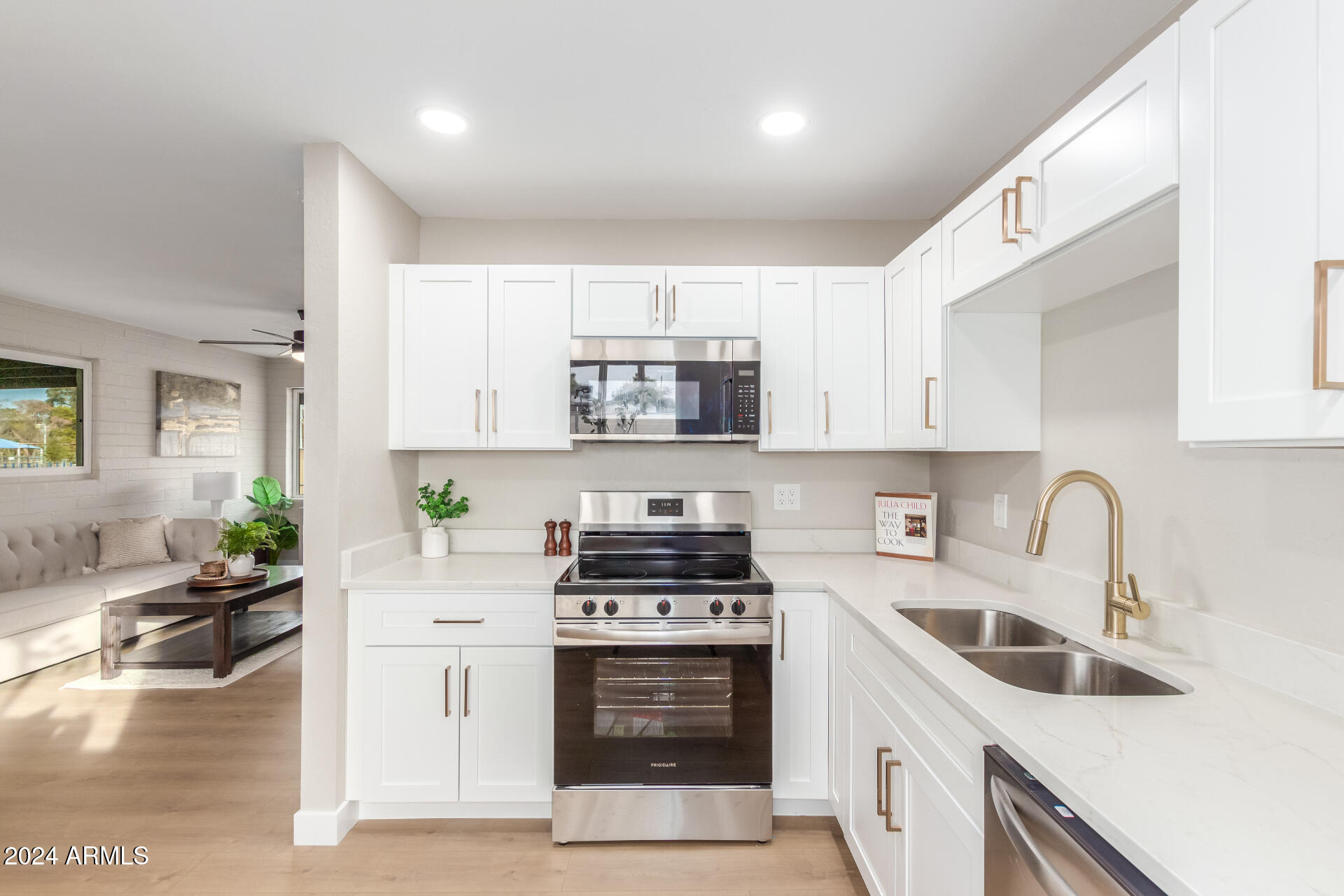 5818 South 20th Street Phoenix, AZ 85040 - Photo 15 of 29 a kitchen with a stove a sink and a refrigerator