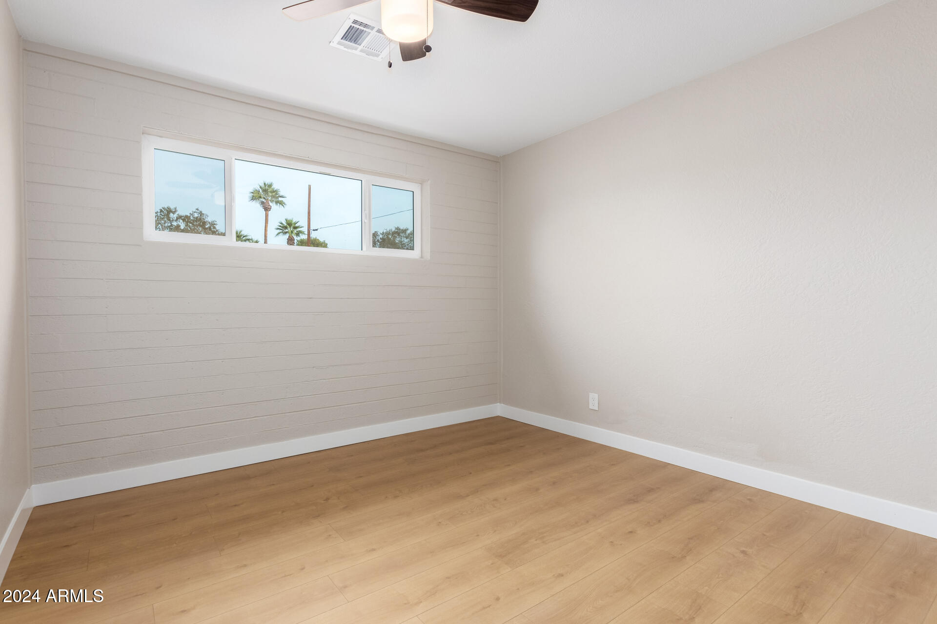 5818 South 20th Street Phoenix, AZ 85040 - Photo 19 of 29 a view of an empty room with a window