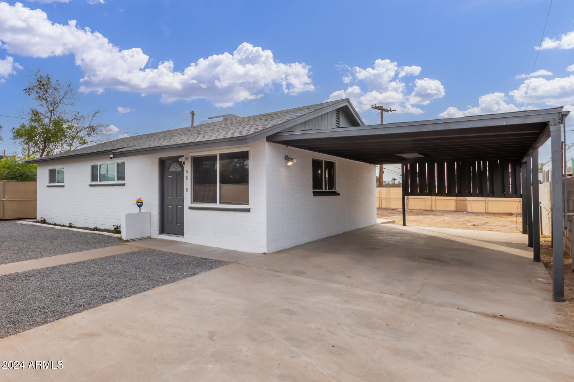5818 South 20th Street Phoenix, AZ 85040 - Photo 2 of 29 a view of a porch with a chandelier
