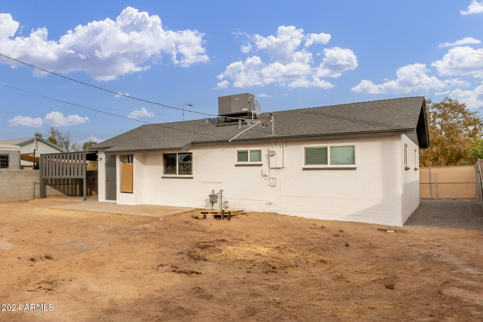 5818 South 20th Street Phoenix, AZ 85040 - Photo 23 of 29 a view of a house with a yard