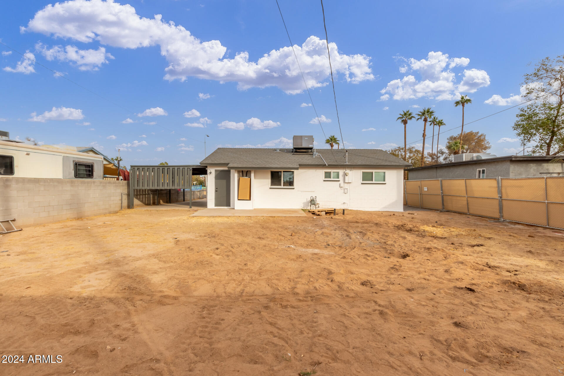 5818 South 20th Street Phoenix, AZ 85040 - Photo 27 of 29 a view of a house with a backyard