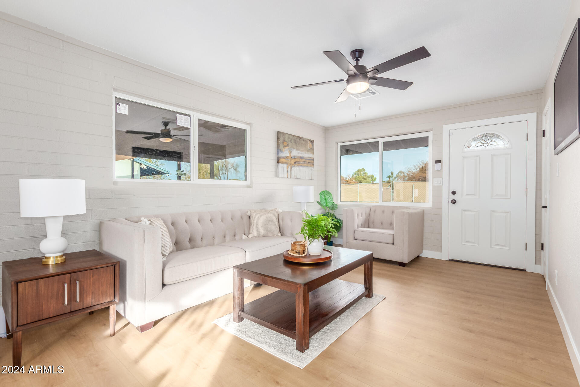 5818 South 20th Street Phoenix, AZ 85040 - Photo 6 of 29 a living room with furniture and window
