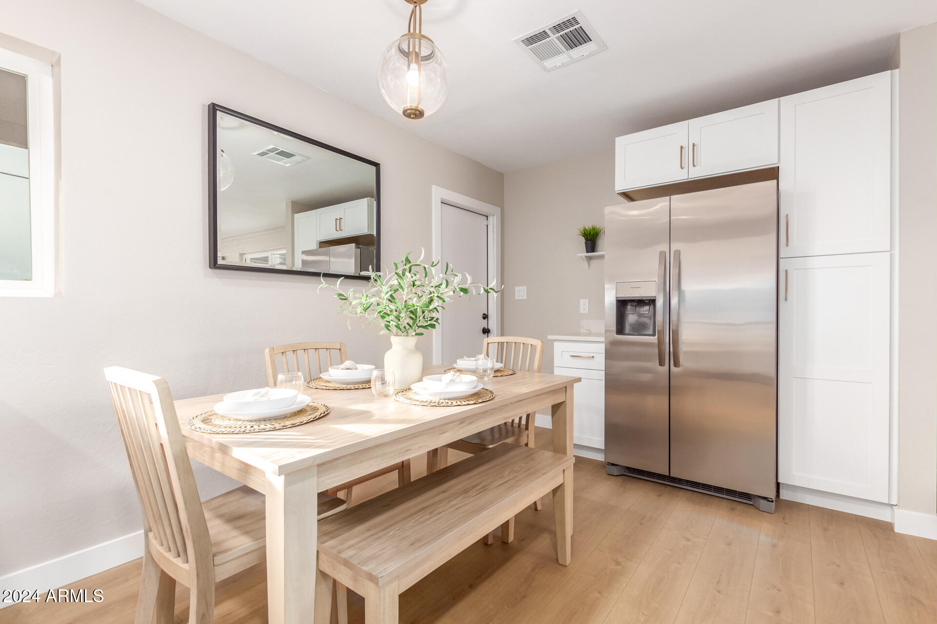 5818 South 20th Street Phoenix, AZ 85040 - Photo 10 of 29 a kitchen with a refrigerator and countertop
