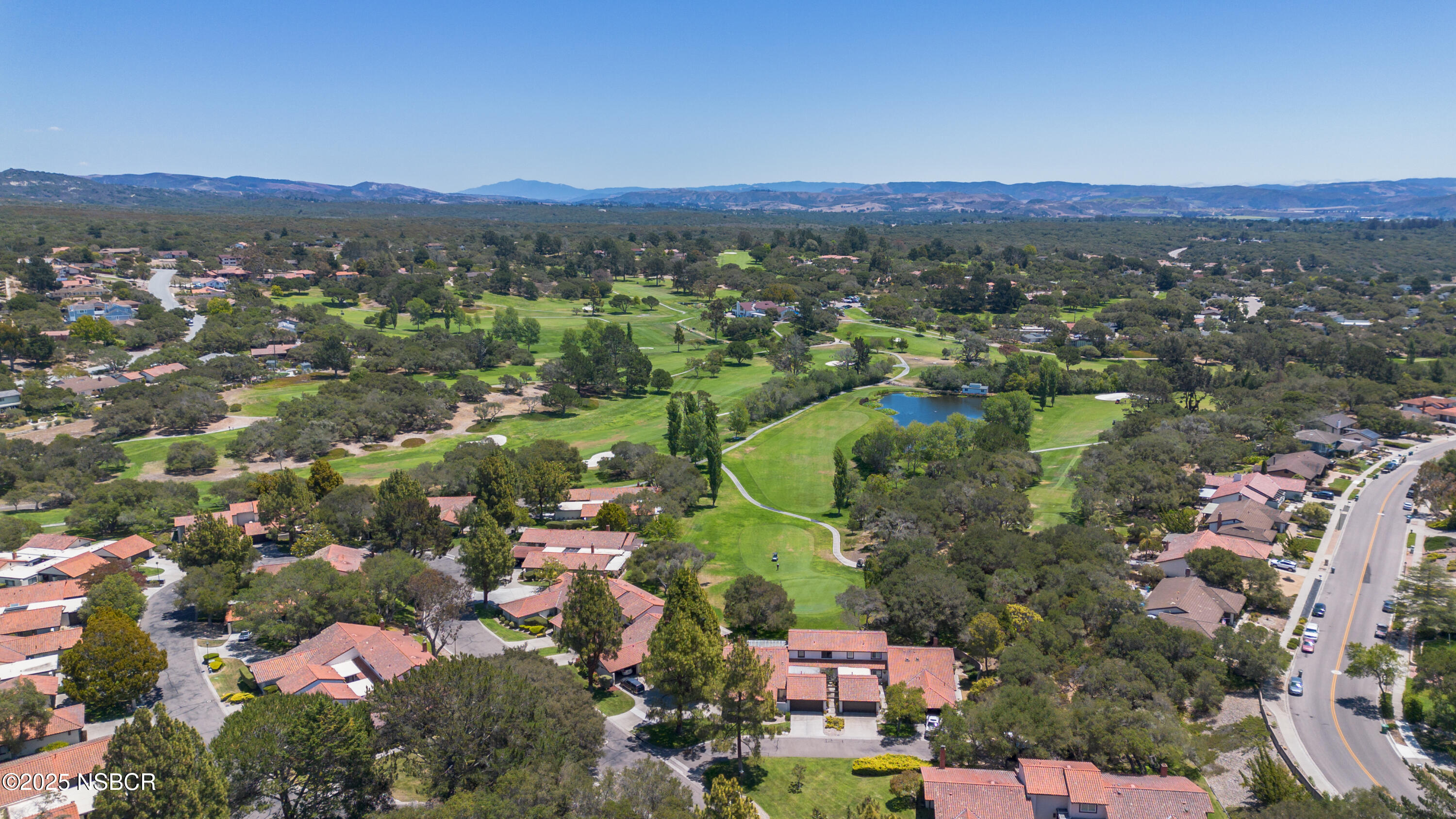 384 Falcon Crest Drive Lompoc, CA 93436 - Photo 13 of 22 an aerial view of a city with lots of residential buildings and mountain view in back