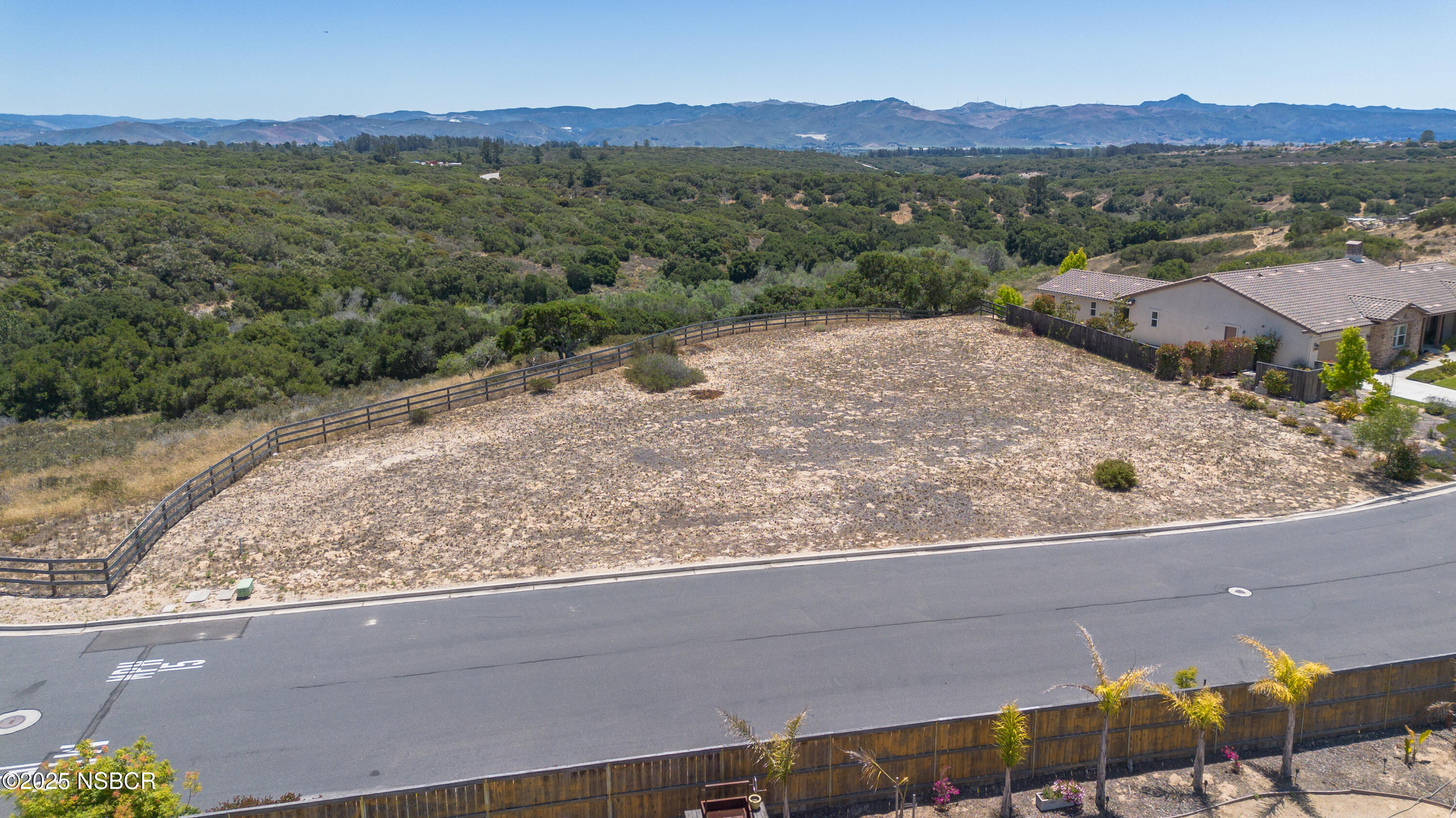 384 Falcon Crest Drive Lompoc, CA 93436 - Photo 8 of 22 a view of a house with a mountain and a forest