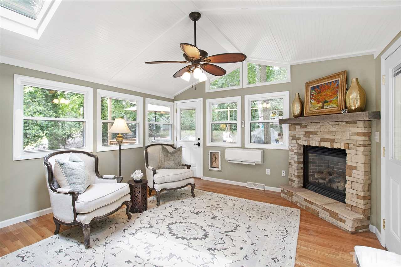 4605 Latimer Road Raleigh, NC 27609 - Photo 14 of 30 a living room with furniture a window and a fireplace