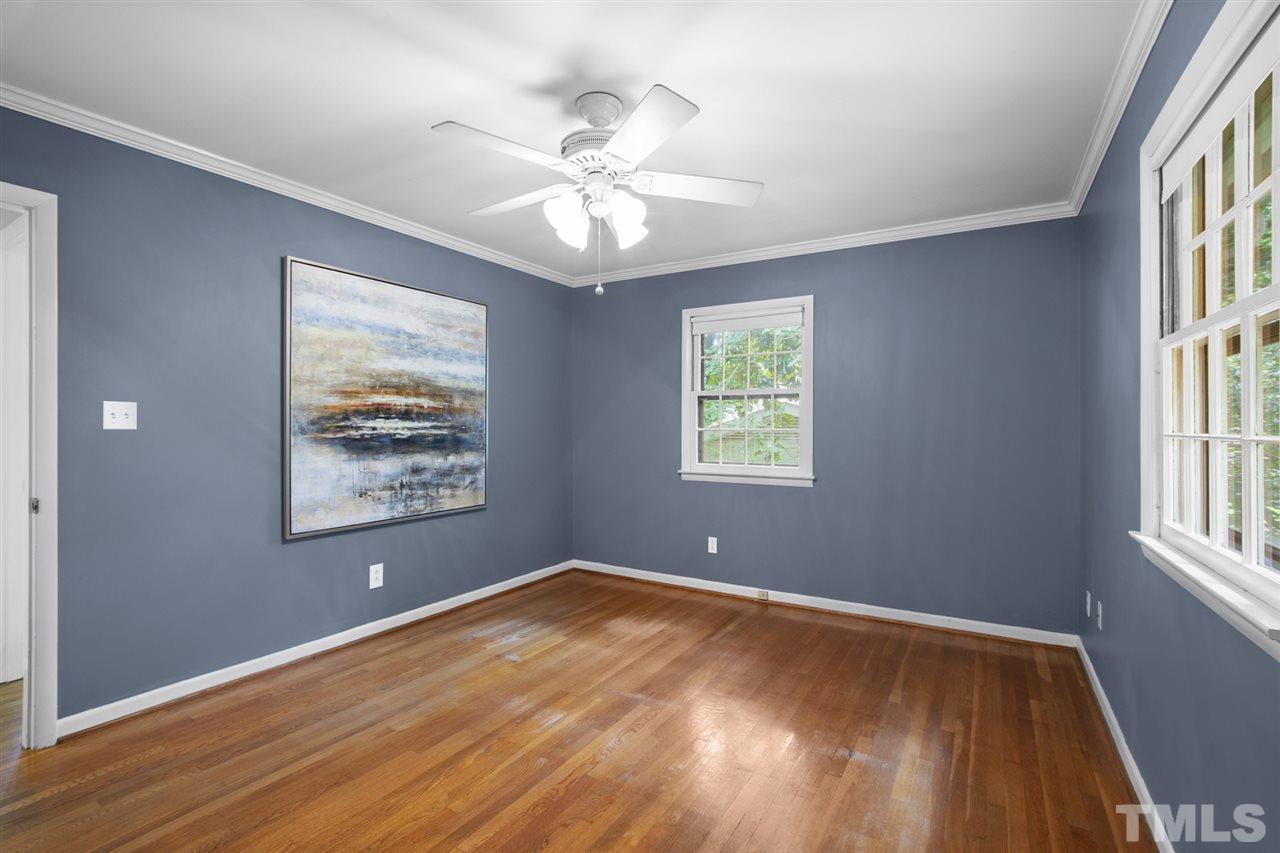 4605 Latimer Road Raleigh, NC 27609 - Photo 16 of 30 a view of an empty room with a window and wooden floor