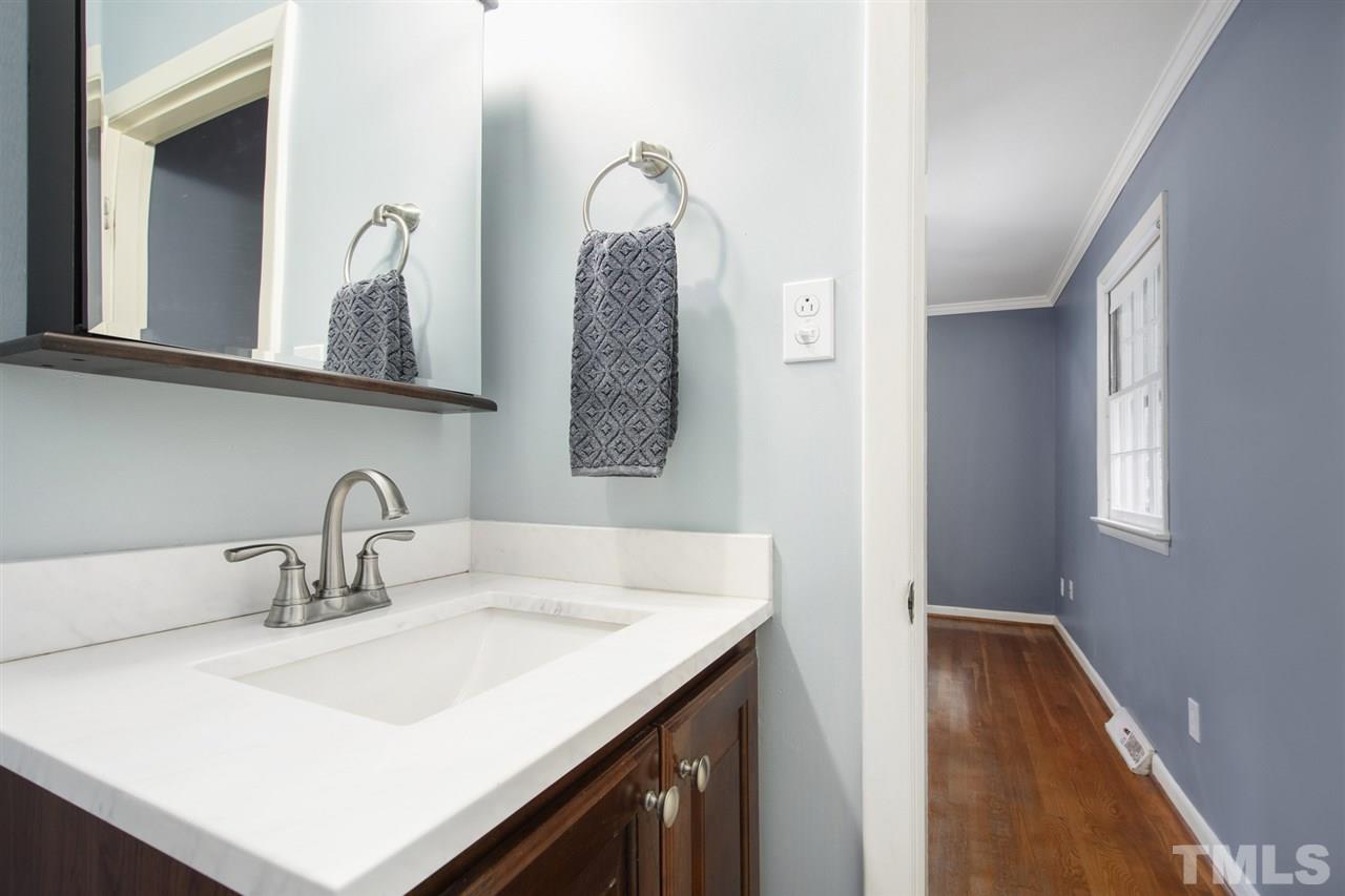 4605 Latimer Road Raleigh, NC 27609 - Photo 18 of 30 a bathroom with a sink and a mirror