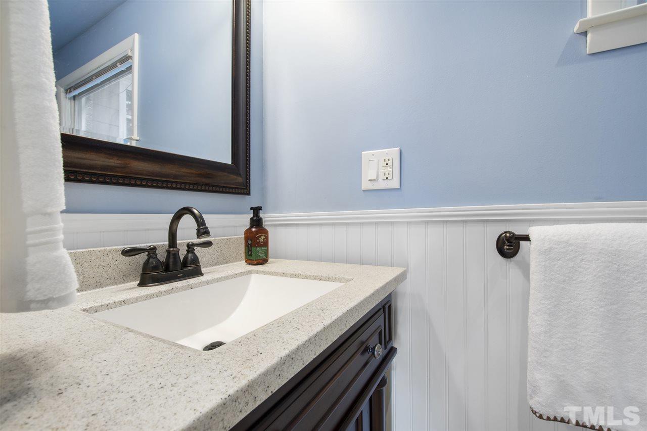 4605 Latimer Road Raleigh, NC 27609 - Photo 19 of 30 a kitchen with a sink a stove and cabinets
