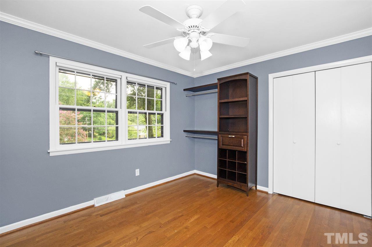 4605 Latimer Road Raleigh, NC 27609 - Photo 21 of 30 a view of an empty room with a window and a ceiling fan