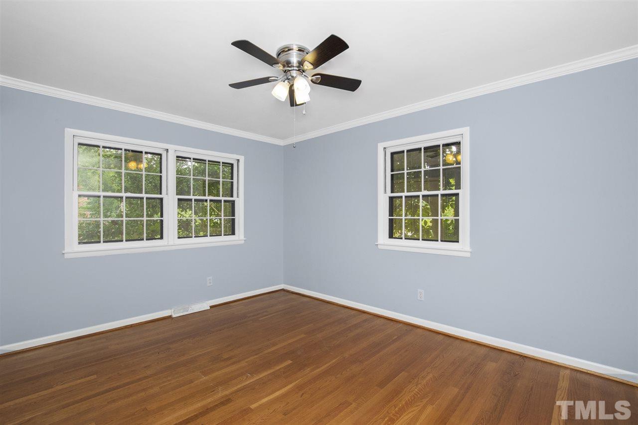 4605 Latimer Road Raleigh, NC 27609 - Photo 25 of 30 an empty room with wooden floor and windows
