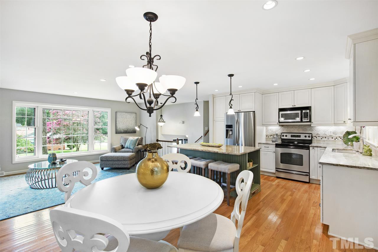 4605 Latimer Road Raleigh, NC 27609 - Photo 8 of 30 a dining room filled chandelier and wooden floor