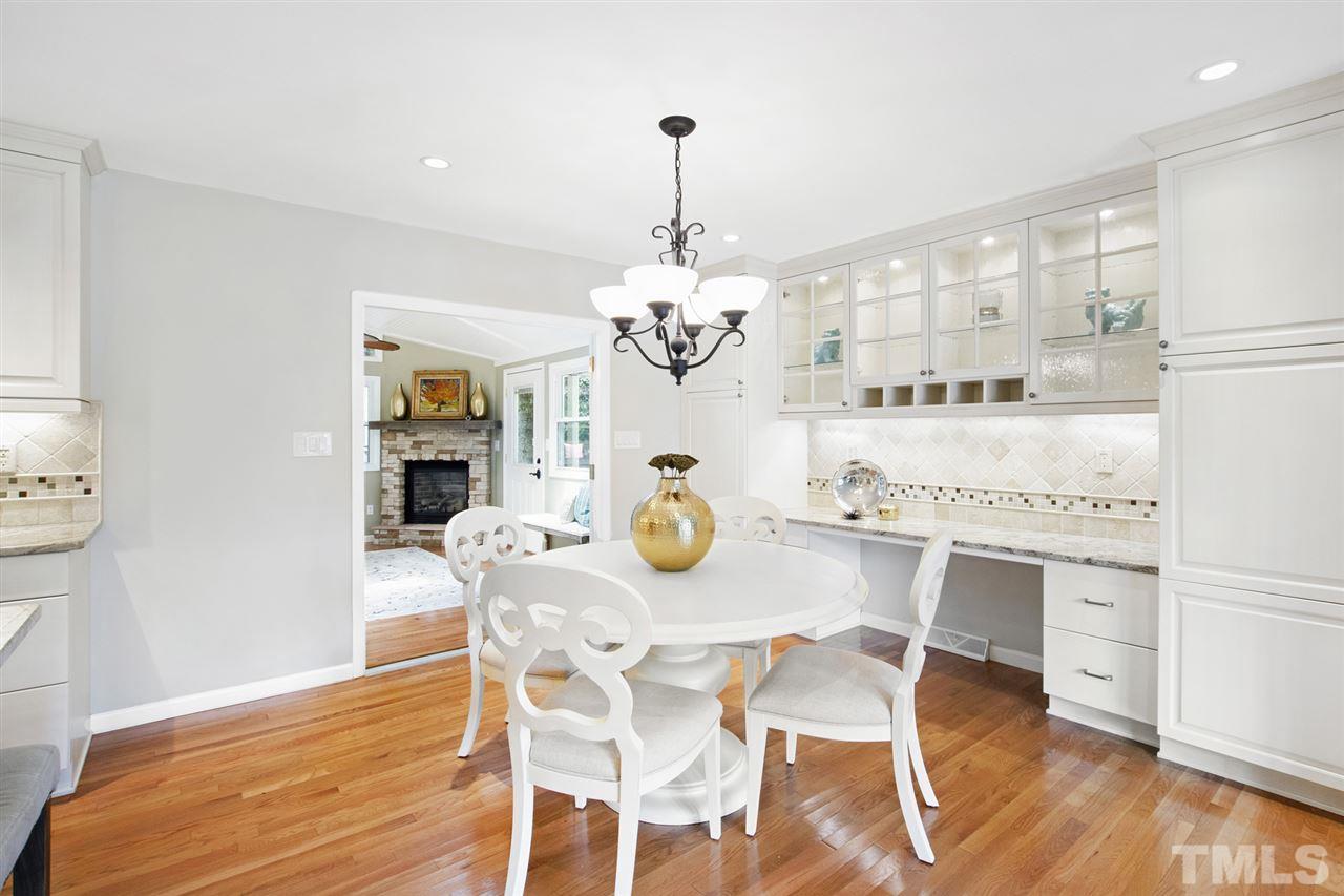 4605 Latimer Road Raleigh, NC 27609 - Photo 10 of 30 a view of a dining room with furniture window and wooden floor