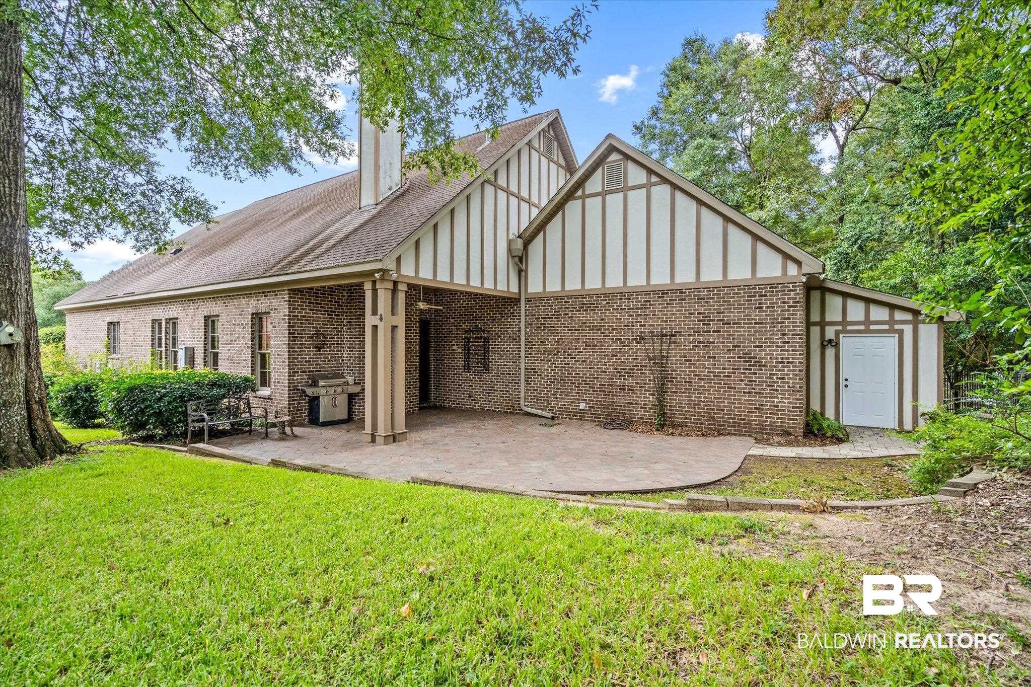 812 Country Club Court Mobile, AL 36609 - Photo 26 of 34 Back of property with a yard and a patio